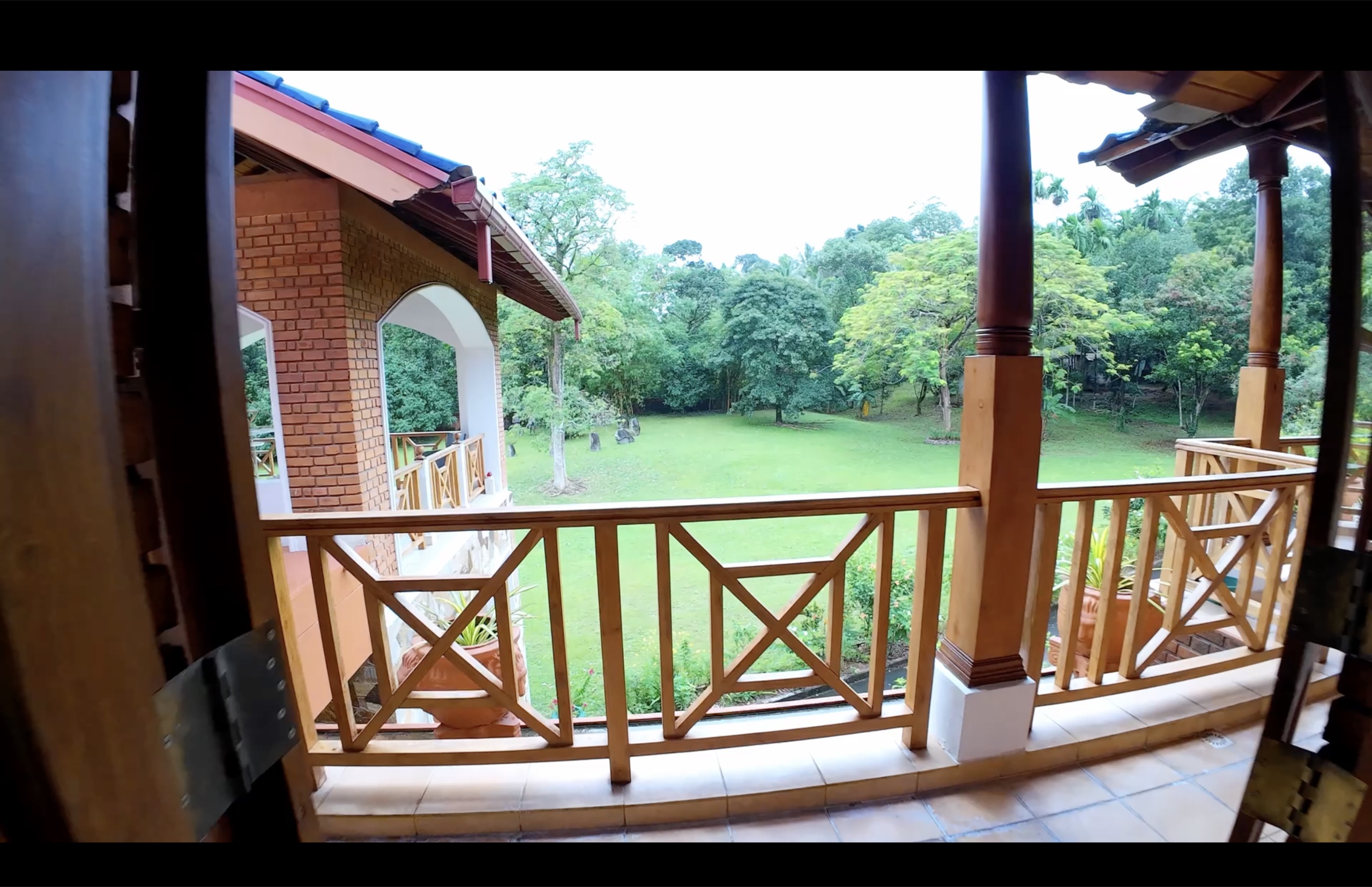 Teak balcony with views across the Oasis Estate gardens and grounds