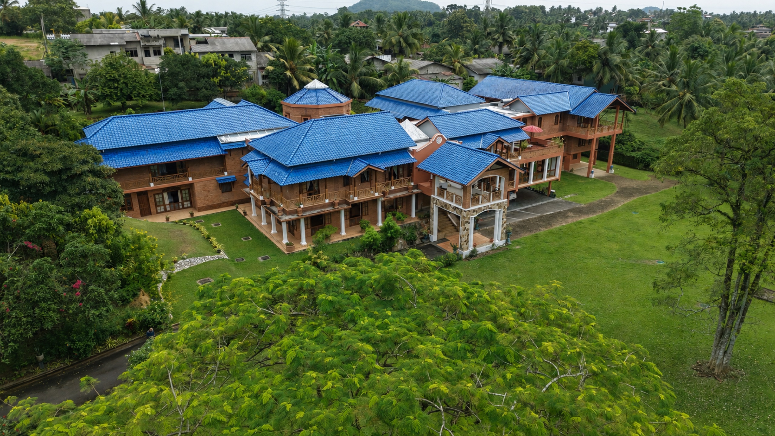 Aerial view of Oasis Estate showing the full residence within private tropical grounds